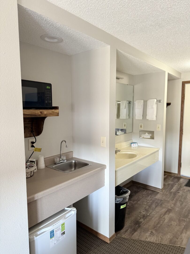 Hotel room kitchenette with mini-fridge.