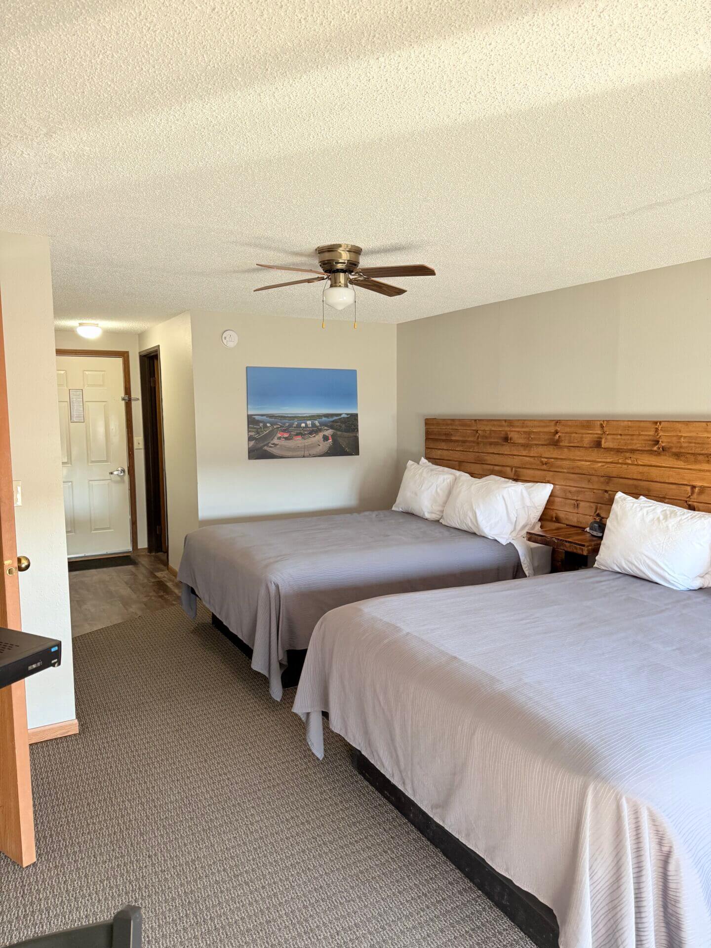 Hotel room with two queen beds.