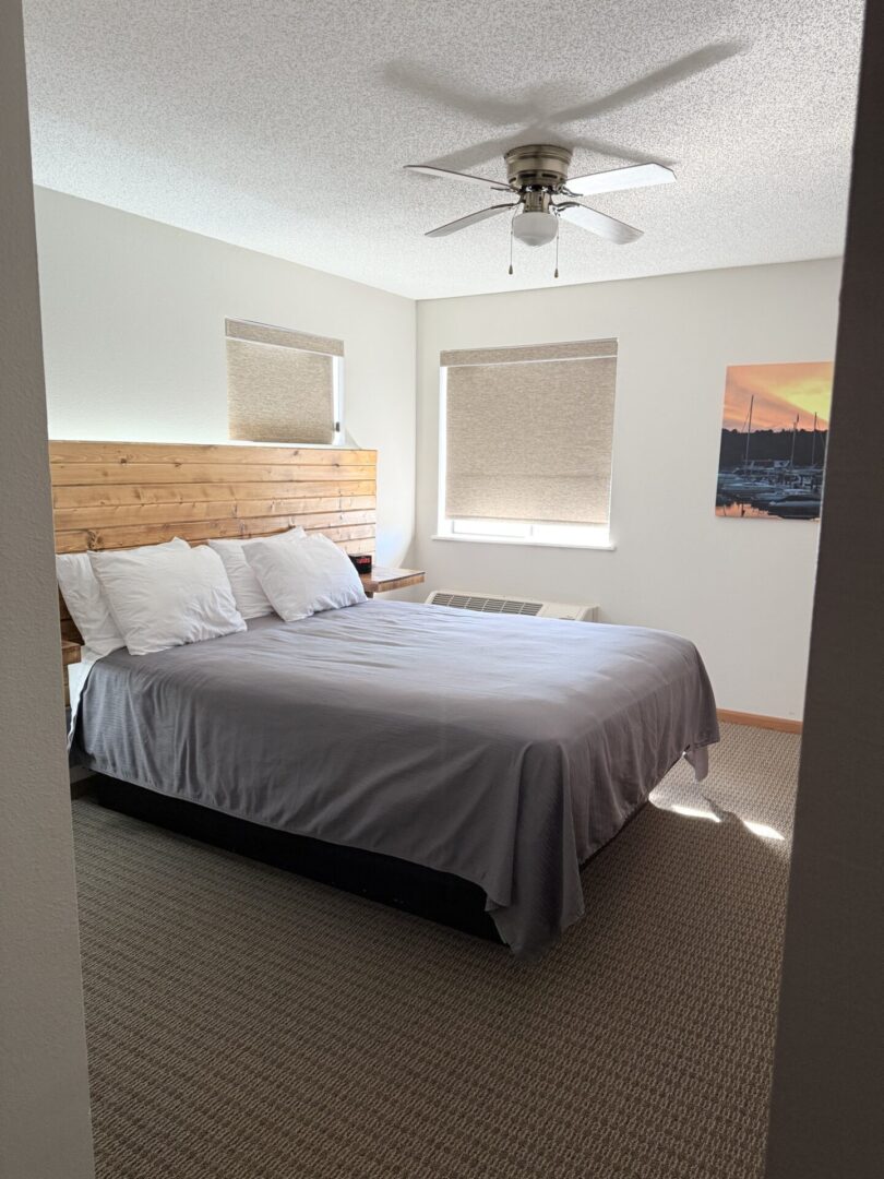 King bed in hotel room with window.